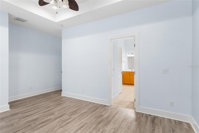 spare room featuring ceiling fan and light wood-type flooring