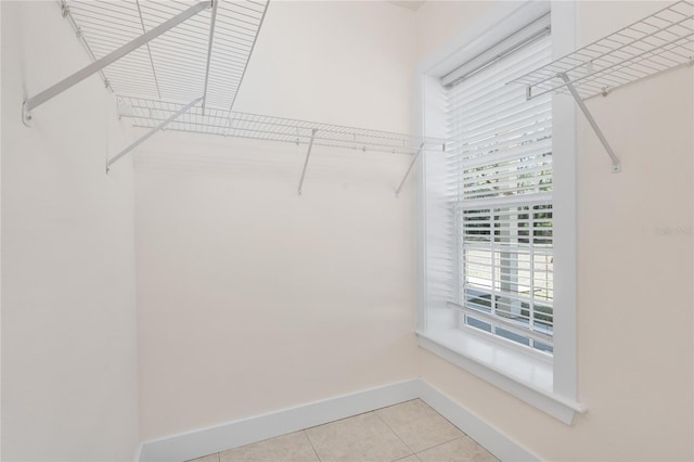 spacious closet featuring light tile patterned flooring