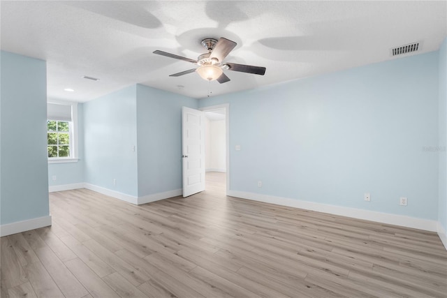 unfurnished room with light wood-type flooring and ceiling fan