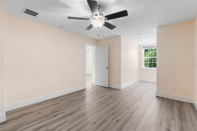 unfurnished room with ceiling fan and light hardwood / wood-style floors