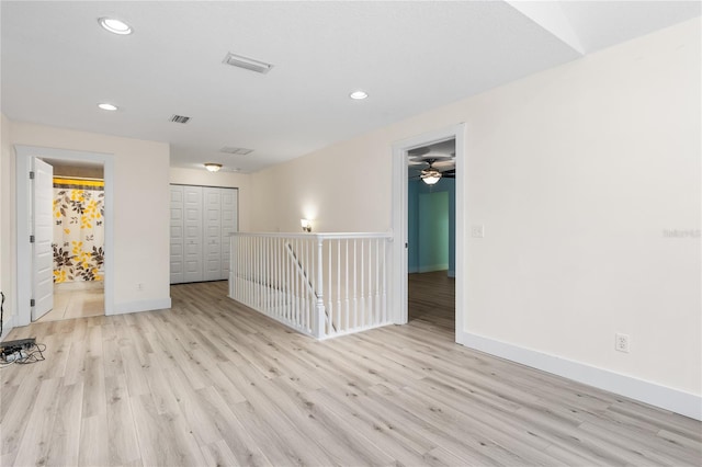 unfurnished room with light hardwood / wood-style floors and ceiling fan