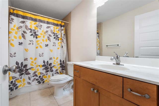 bathroom featuring toilet, tile patterned flooring, walk in shower, and vanity