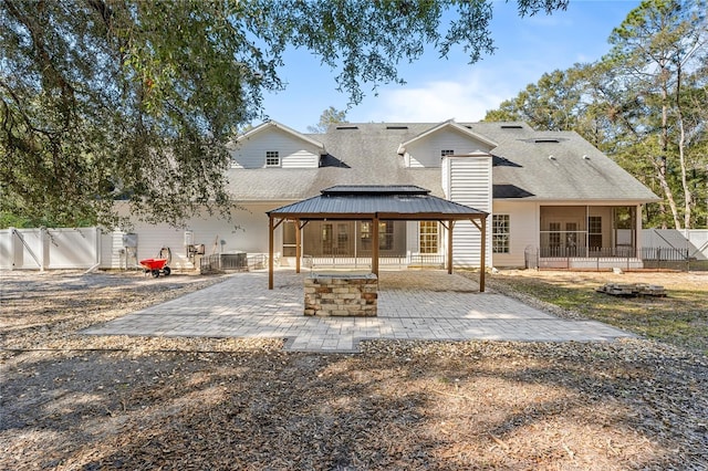 back of house featuring a gazebo and a patio