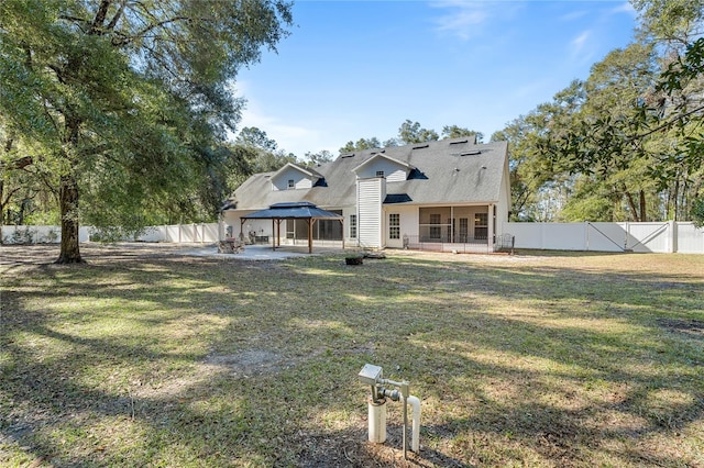 view of front of home with a gazebo, a patio area, and a front yard