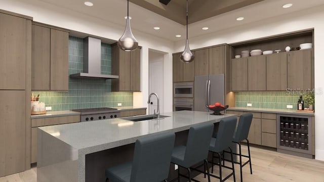 kitchen with a spacious island, wall chimney exhaust hood, sink, and stainless steel appliances