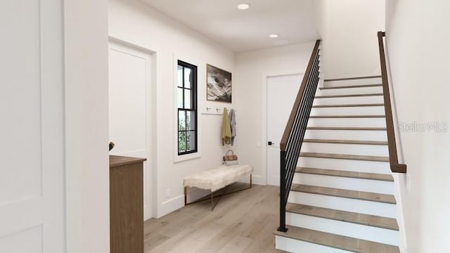 stairway with hardwood / wood-style floors