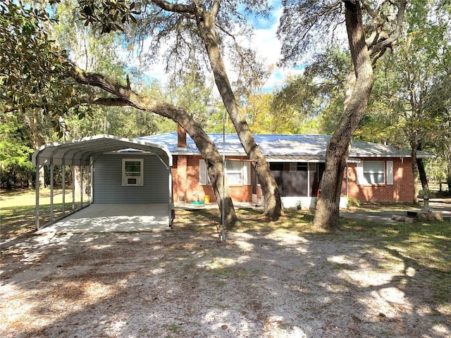 ranch-style home with a carport