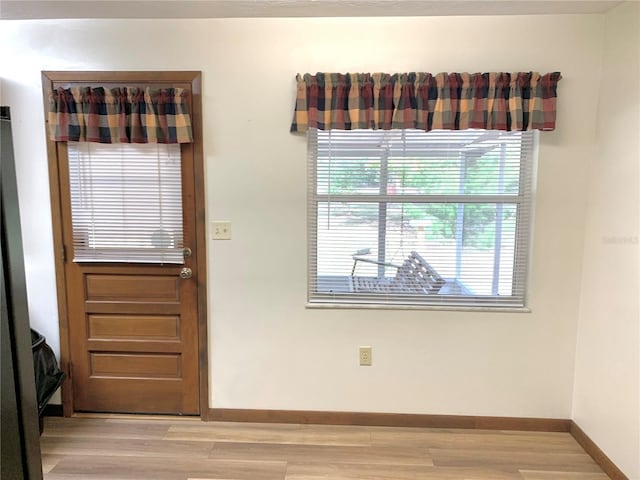 doorway to outside featuring light hardwood / wood-style flooring