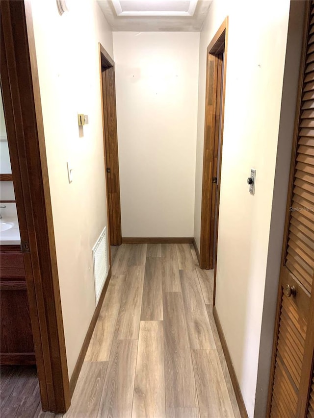 hallway featuring light hardwood / wood-style flooring