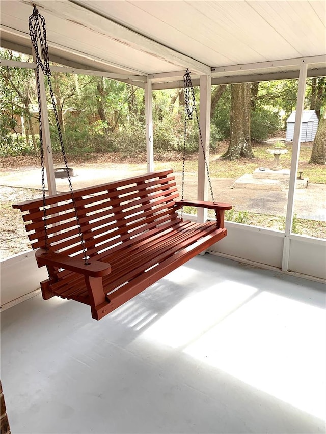 unfurnished sunroom with wood ceiling