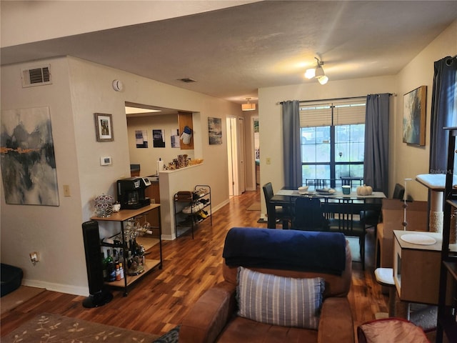 living room featuring dark hardwood / wood-style flooring