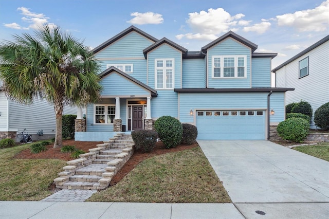 view of front facade featuring a front yard and a garage