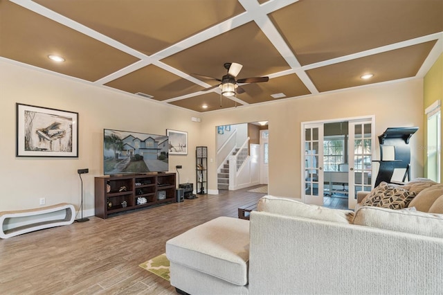 living room with hardwood / wood-style floors, ceiling fan, french doors, and coffered ceiling