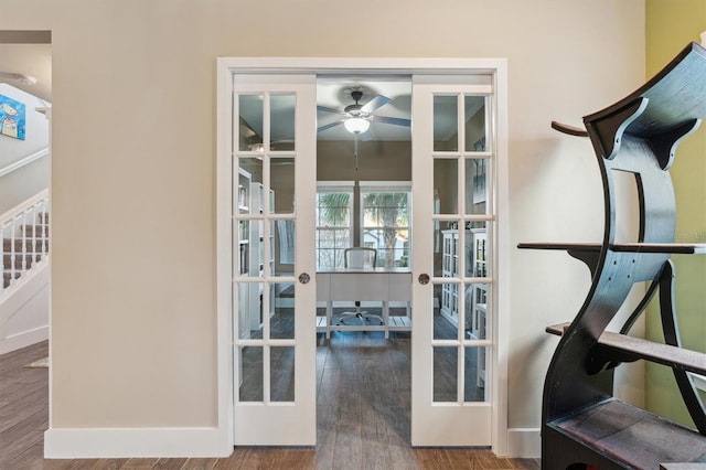 doorway with hardwood / wood-style flooring, ceiling fan, and french doors