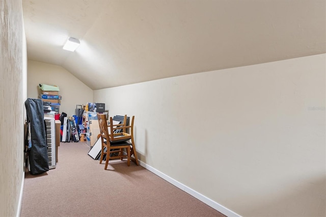 bonus room with lofted ceiling and carpet floors