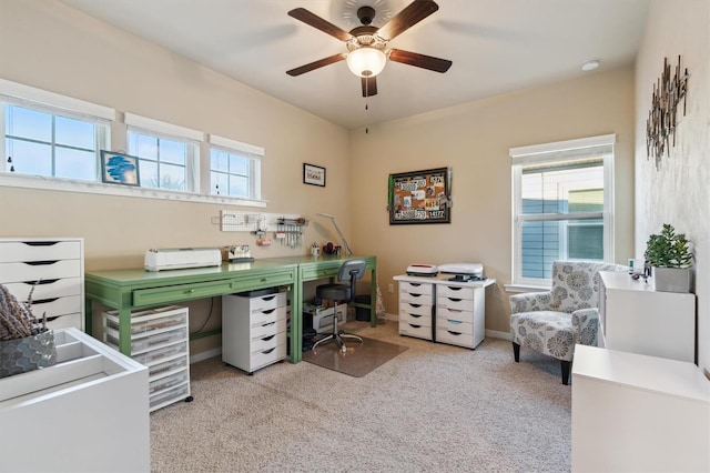 office area with light colored carpet and ceiling fan