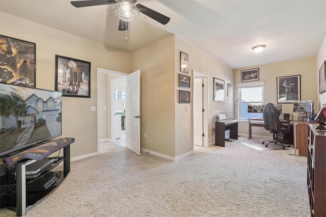 office area featuring ceiling fan and light carpet