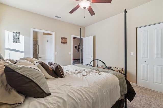 bedroom with ceiling fan, a closet, and light carpet