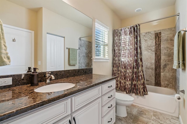 full bathroom with shower / bathtub combination with curtain, vanity, and toilet