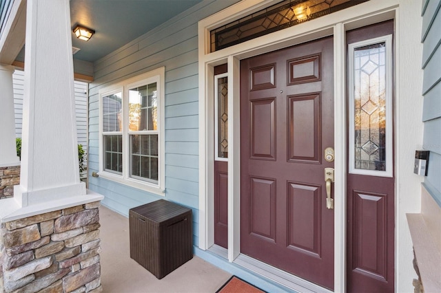 doorway to property featuring a porch