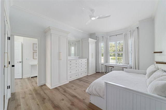 bedroom featuring light wood-type flooring, ceiling fan, and crown molding