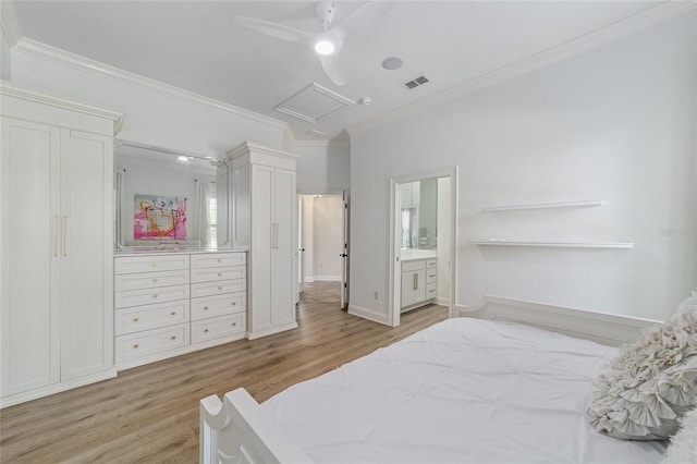 bedroom featuring ceiling fan, light wood-type flooring, crown molding, and connected bathroom