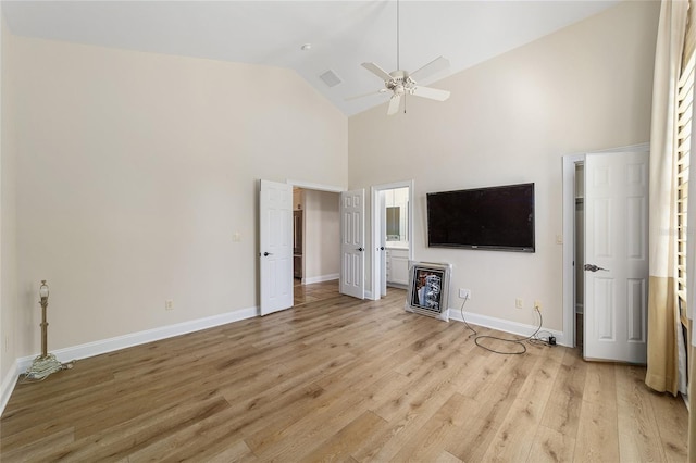 unfurnished living room with ceiling fan, light hardwood / wood-style flooring, and high vaulted ceiling