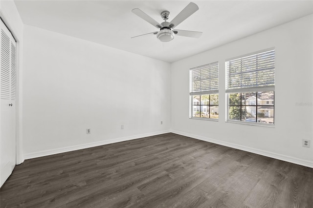 unfurnished bedroom featuring a closet, dark hardwood / wood-style floors, and ceiling fan