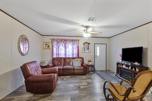 living room featuring ceiling fan and dark hardwood / wood-style flooring