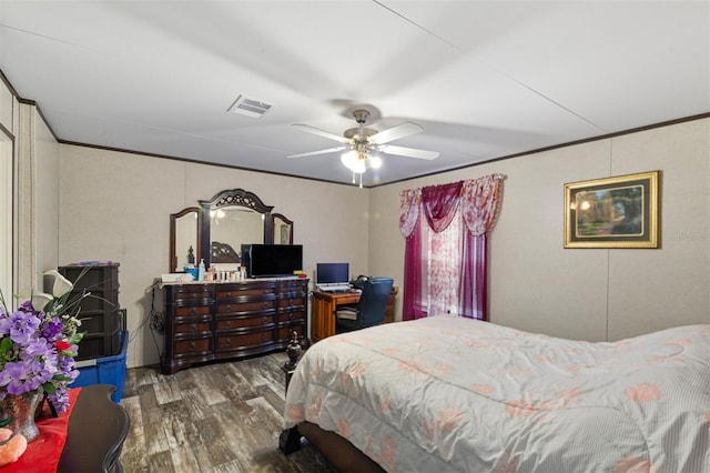 bedroom with ceiling fan, dark hardwood / wood-style flooring, and ornamental molding