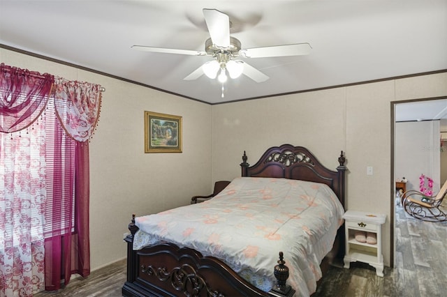 bedroom featuring multiple windows, ceiling fan, hardwood / wood-style floors, and crown molding