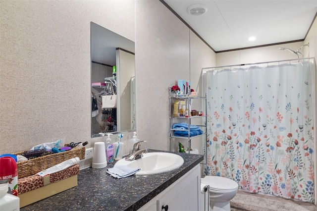 bathroom featuring a shower with curtain, crown molding, vanity, and toilet