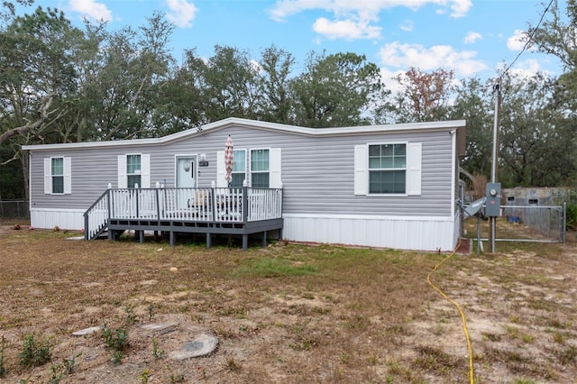 view of front of property featuring a wooden deck