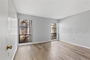 spare room with light wood-type flooring