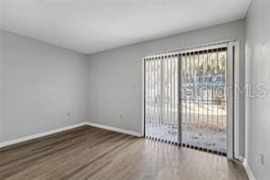 empty room featuring hardwood / wood-style flooring