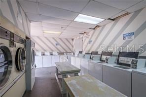 clothes washing area with washing machine and clothes dryer