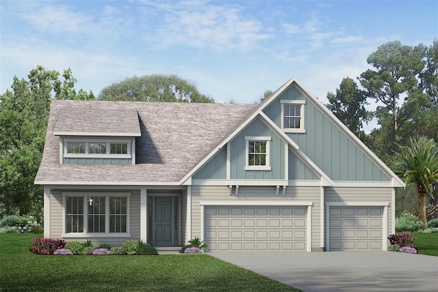 view of front of house with a garage and a front lawn