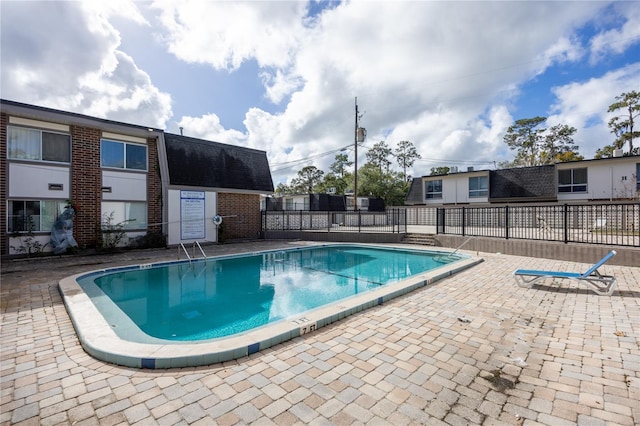 view of pool featuring a patio