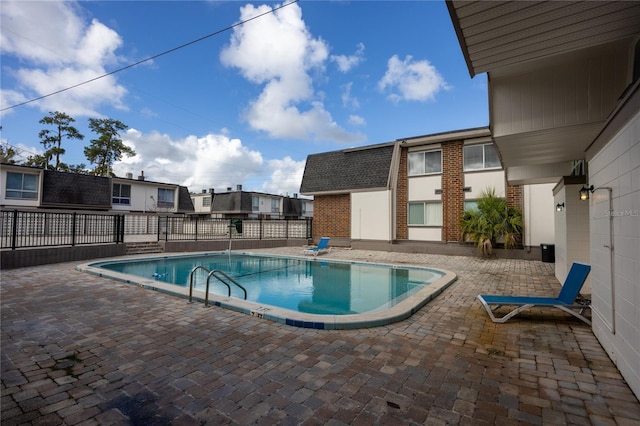 view of swimming pool with a patio area