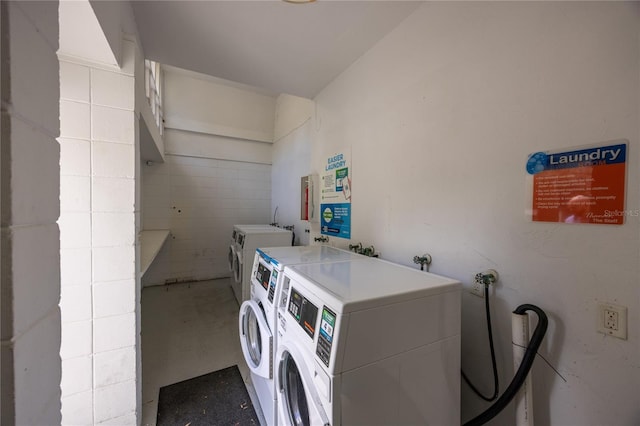 washroom featuring washing machine and dryer