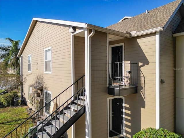 view of side of home featuring cooling unit