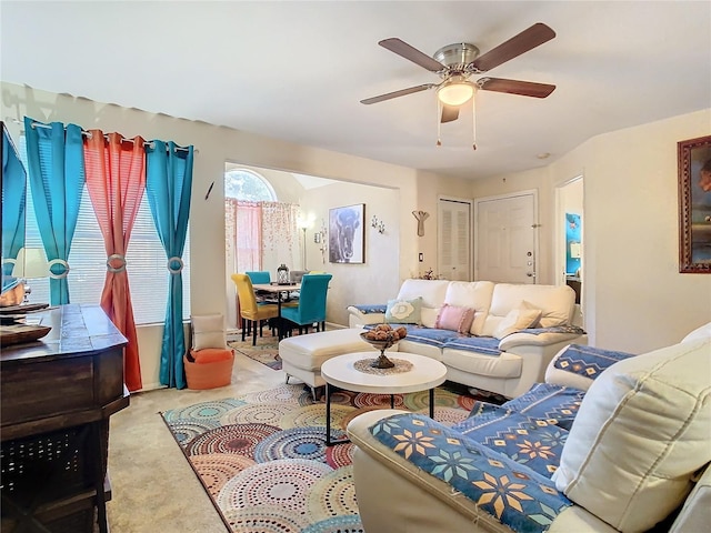 carpeted living room featuring ceiling fan