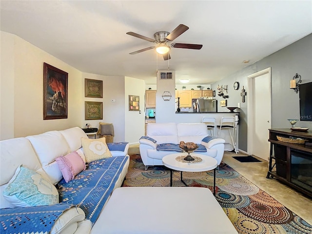 carpeted living room featuring ceiling fan