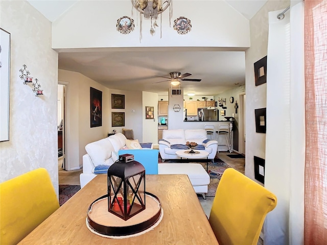 living room featuring vaulted ceiling and ceiling fan