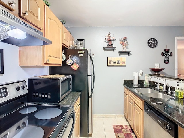 kitchen with light brown cabinetry, sink, stainless steel appliances, and light tile patterned flooring