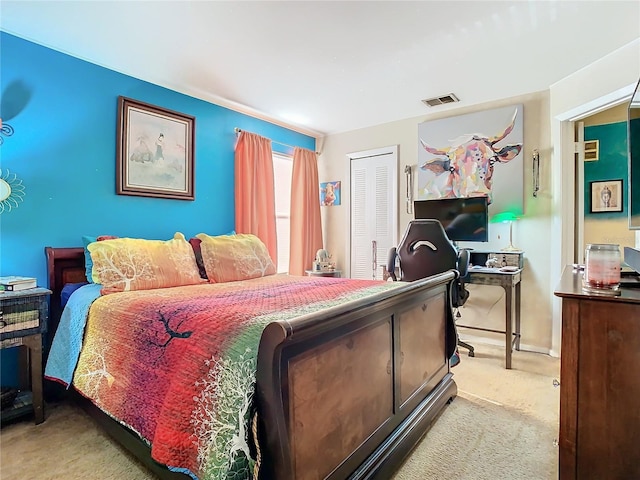 carpeted bedroom featuring a closet