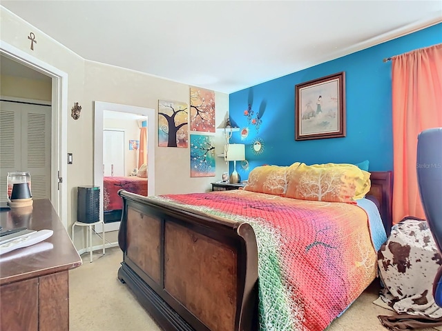 bedroom featuring light carpet