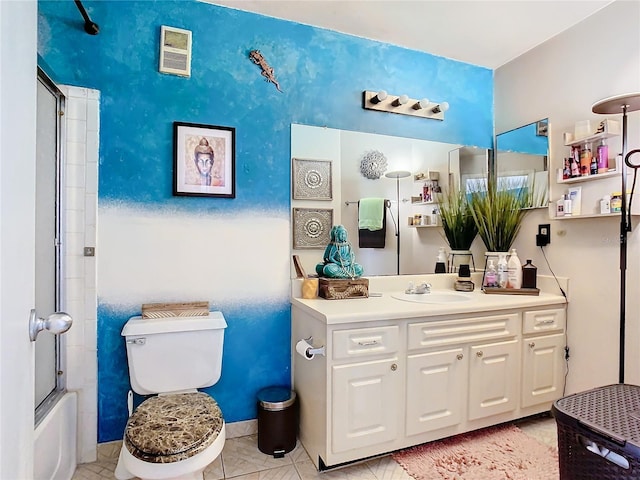 full bathroom with tile patterned floors, vanity, bath / shower combo with glass door, and toilet