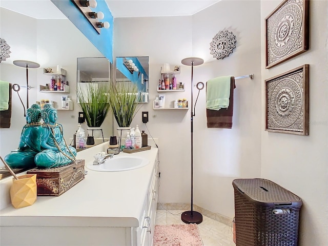 bathroom with tile patterned flooring and vanity