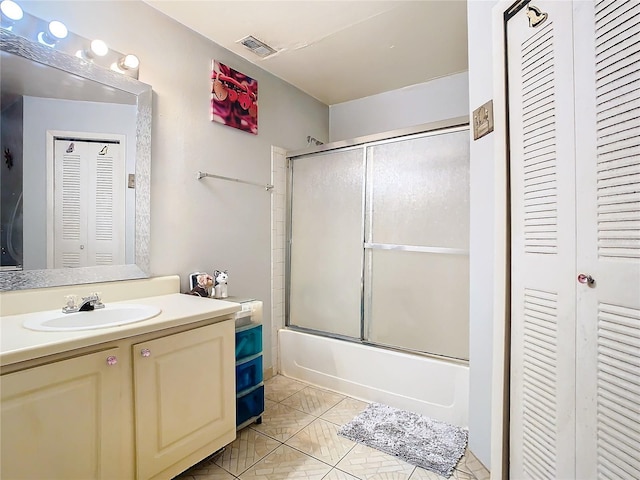 bathroom featuring vanity and enclosed tub / shower combo